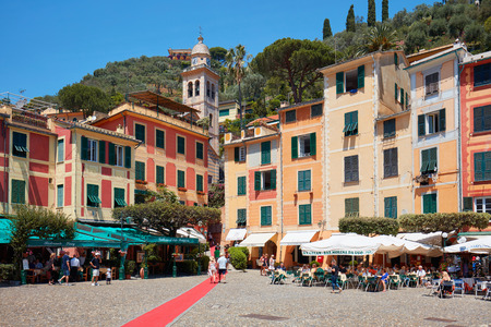 Portofino typical beautiful village square with colorful houses and luxury shops on June 10, 2017 in Portofino, Italy. The town is one of the most exclusive holiday places in Liguria.のeditorial素材