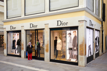 VENICE, ITALY - AUGUST 12, 2017: Dior store with large windows and people in Venice, Italyのeditorial素材