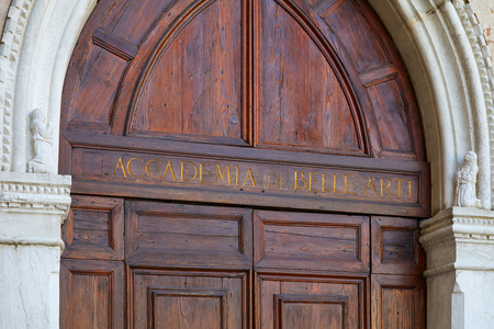 Venice, Academy of Fine Arts wooden portal with golden letters sign in Italyのeditorial素材