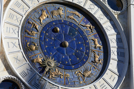 Golden zodiac astrological clock, sunlight and shadowの写真素材