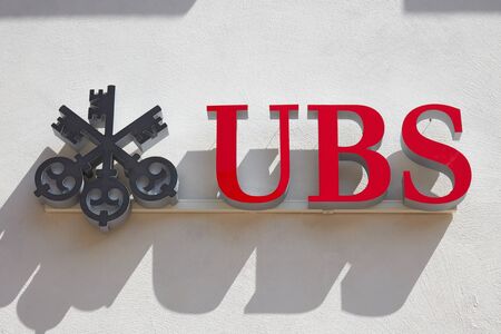 SANKT MORITZ, SWITZERLAND - AUGUST 16, 2018: UBS swiss bank sign in a sunny day in Sankt Moritz, Switzerlandのeditorial素材
