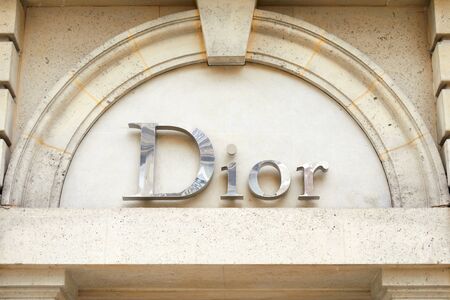 PARIS, FRANCE - JULY 22, 2017: Dior, fashion luxury, silver sign in avenue Montaigne in Paris, France.のeditorial素材