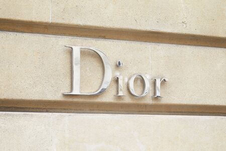 PARIS, FRANCE - JULY 22, 2017: Dior, fashion luxury, silver sign in avenue Montaigne in Paris, France.のeditorial素材