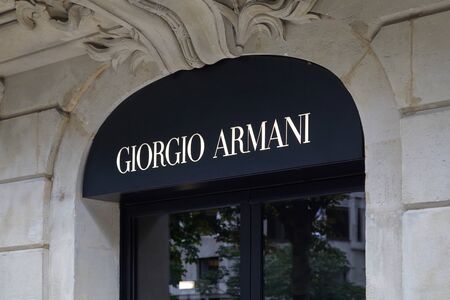 PARIS, FRANCE - JULY 22, 2017: Giorgio Armani black and white sign, fashion luxury store in avenue Montaigne in Paris, France.のeditorial素材