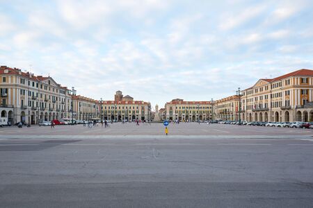 CUNEO, ITALY - AUGUST 13, 2016: Central Galimberti square with people, wide angle view at dusk, blue sky in Cuneo, Italy.のeditorial素材