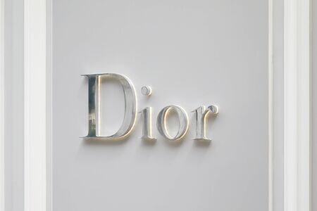 PARIS, FRANCE - JULY 22, 2017: Dior fashion luxury store silver sign in avenue Montaigne in Paris, France.のeditorial素材