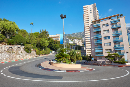 Monte Carlo street curve with formula one red and white signs in a sunny summer day in Monte Carlo, Monacoの写真素材