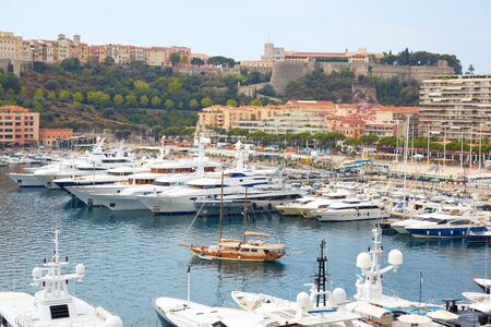 MONTE CARLO, MONACO - AUGUST 20, 2016: Monte Carlo harbor view with boats and luxury yachts in a summer day in Monte Carlo, Monaco.のeditorial素材