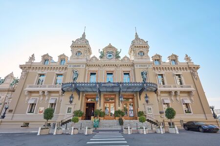 MONTE CARLO, MONACO - AUGUST 21, 2016: Casino building facade with Ferrari in a sunny summer day in Monte Carlo, Monaco.のeditorial素材