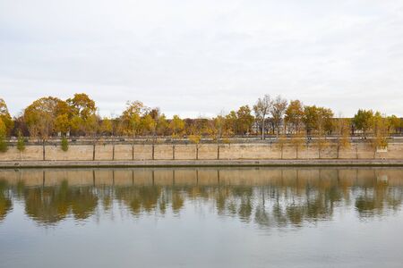 Seine river riverside in a cloudy autumn day in Paris, Franceの写真素材