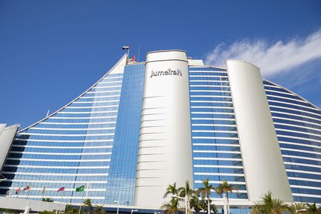 DUBAI, UNITED ARAB EMIRATES - NOVEMBER 23, 2019: Jumeirah Beach luxury hotel low angle view in a sunny day, blue sky in Dubaiのeditorial素材