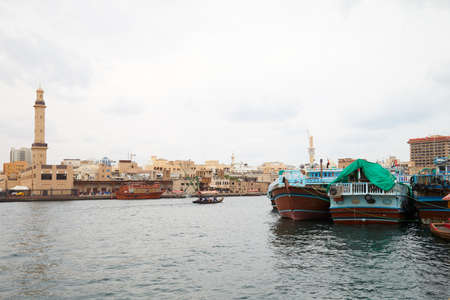 DUBAI, UNITED ARAB EMIRATES - NOVEMBER 21, 2019: Dubai creek, ancient buildings and canal with abra...