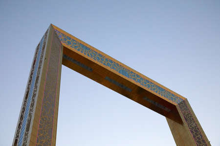 DUBAI, UNITED ARAB EMIRATES - NOVEMBER 22, 2019: Dubai Frame, golden observation attraction in the evening, low angle view and clear skyのeditorial素材