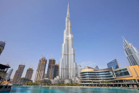 DUBAI, UNITED ARAB EMIRATES - NOVEMBER 19, 2019: Burj Khalifa skyscraper, artificial lake and modern...