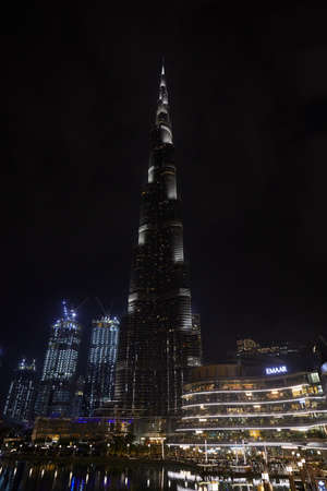 DUBAI, UNITED ARAB EMIRATES - NOVEMBER 19, 2019: Burj Khalifa skyscraper and Dubai Mall illuminated at nightのeditorial素材