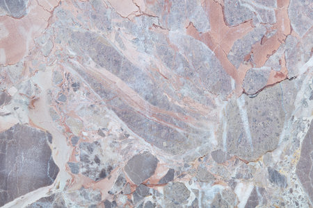 Grey, variegated stone texture background with cracks