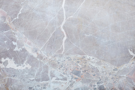 Grey, variegated stone texture background with white veinの写真素材