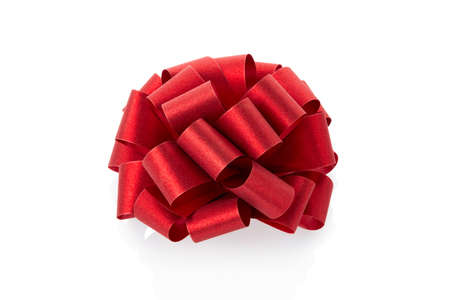 Red glitter bow on white backgroundの写真素材