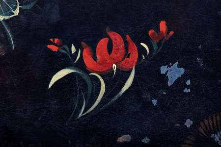 Red flowers painted on ancient, black backgroundの写真素材