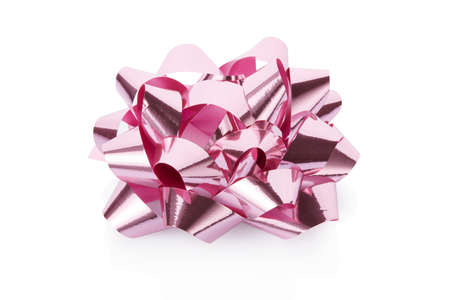 Pink, shiny gift bow isolated on white backgroundの写真素材