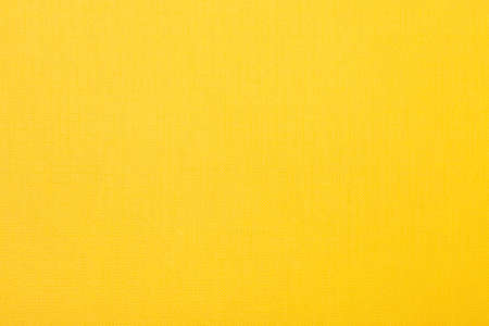 Bright yellow textured paper background, detailedの写真素材