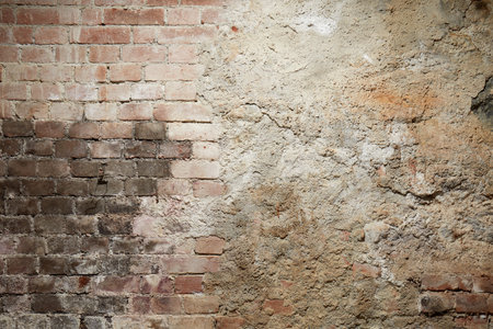 Old brick and cement wall with black burned partの写真素材