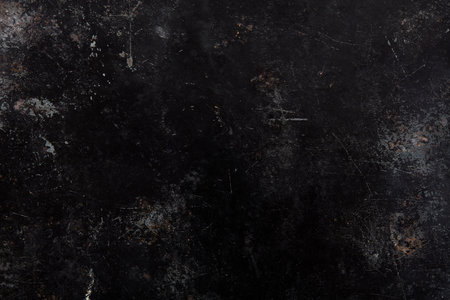 Black, damaged metal texture backgroundの写真素材