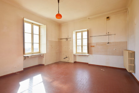 Old, empty kitchen in country house, sunlightの写真素材