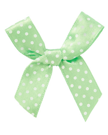 Pale green bow with white dots isolated on whiteの写真素材