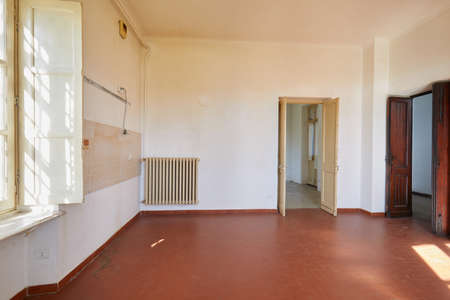 Old, empty kitchen in country house, sunlightの写真素材