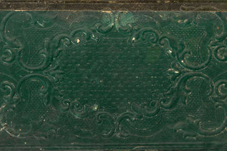Ancient, green book cover with decoration texture backgroundの写真素材