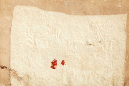 Old, crumpled paper with red sealing wax sign texture backgroundの写真素材