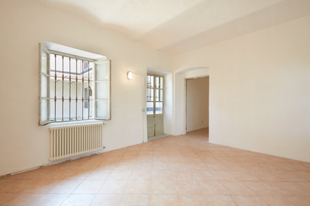 Empty room in apartment interior with white walls in old country houseの写真素材