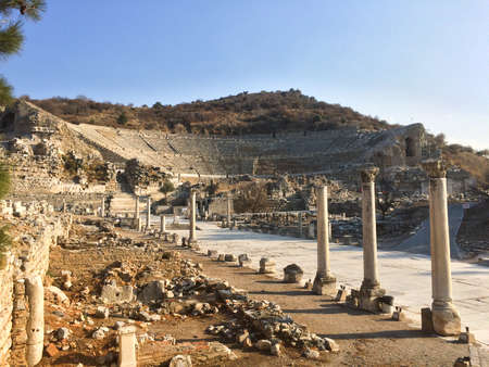 Roman stone road with pillars to amphitheater ruins in Ephesus Archaeological site in turkeyの写真素材