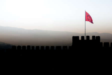 Panorama with Silhouette of Ayasoluk Castle walls with turkish flag in Selcuk near Ephesus in turkeyの写真素材