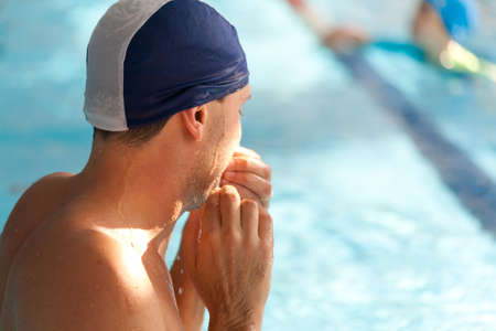 Swimming Kids Lesson red tshirt coach close to poolsideの写真素材