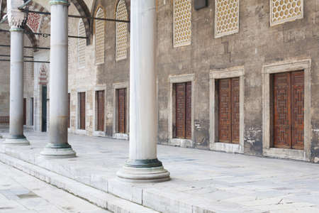 Portico with marble columns and doors in a row in the courtyard of an ancient mosqueのeditorial素材