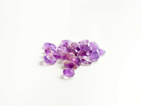 Tumbled Amethyst stones close up on table for crystal therapy treatments and reikiの写真素材