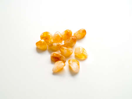 Tumbled Citrine Quartz stones close up from top for crystal therapy treatments and reiki