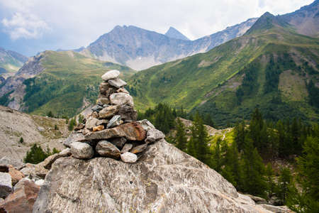 Stoneman in a mountain landscapeの写真素材