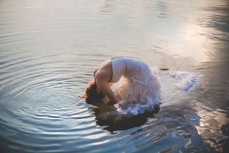 bride on the water in the lakeの写真素材