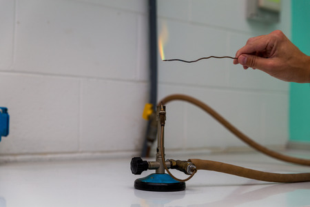 powder test a Bunsen burner showing flame and hose.の写真素材
