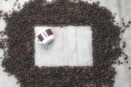 frame of coffee beans with a cupの写真素材