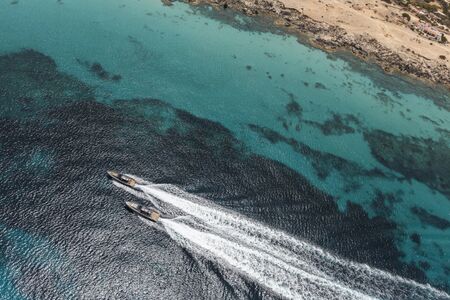 inflatable motor boat in formentera, navigate in the beautiful sea of baleares islandsの写真素材