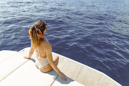 Caucasian amazing woman relaxing on the yacht, amalfi coast, italyの写真素材