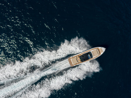 Aerial view of luxury yacht with motor boat in the sea.の写真素材