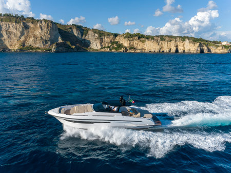 Motor boat on the background of the rocky coast of the Black Seaの写真素材