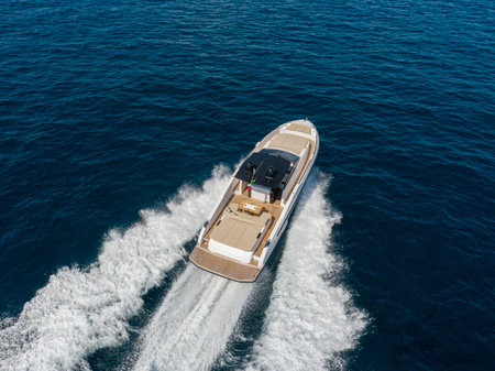 Aerial view of a luxury motor boat sailing in the sea.の写真素材