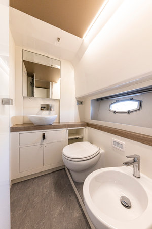 yacht Interior of a modern bathroom with white bathtub and toilet. Nobody insideの写真素材