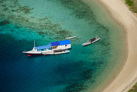 boat in the bay of the island komodoの写真素材